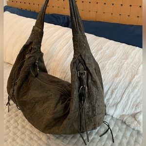 Genuine leather hobo bag with tassels, hardware and a rock n’ roll vibe